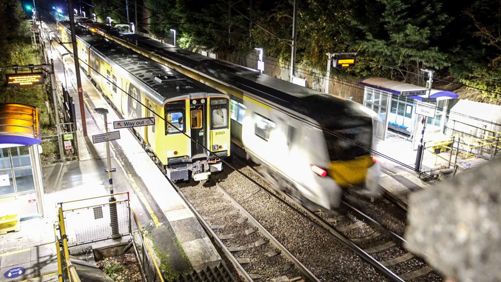 Automatically operated trains passing at a station