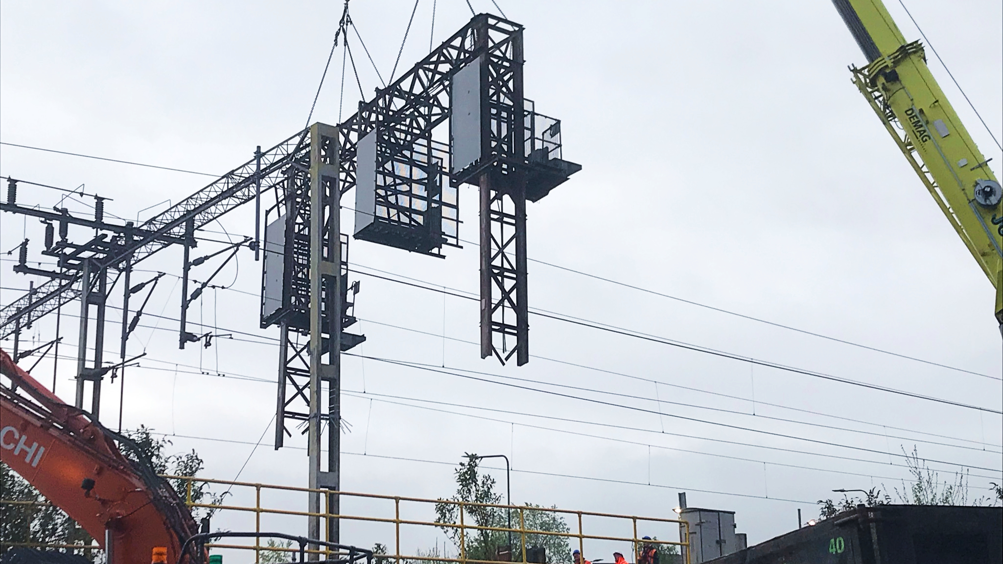 Old signalling gantry being lifted out by crane in Macclesfield.
