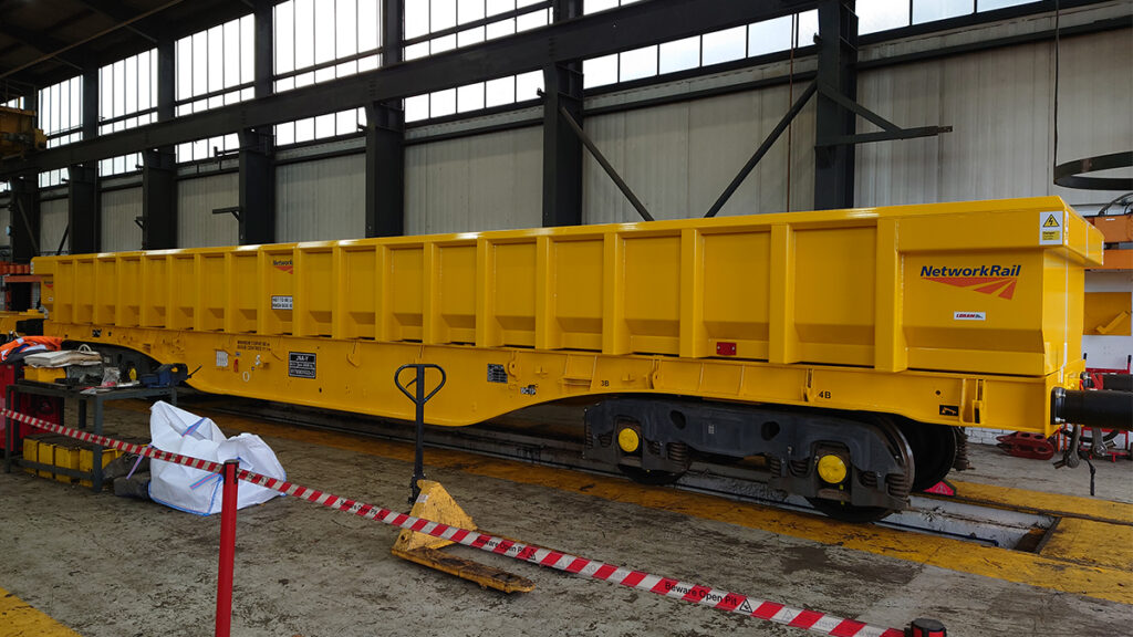 A yellow repurposed box wagon inside a warehouse